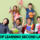 Children holding flags and notebooks, smiling, with text 'Benefits of Learning Second Language'