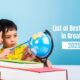 Two young children exploring a globe together with books around them, promoting a list of best preschools in Greater Noida for the academic year 2025-2026.
